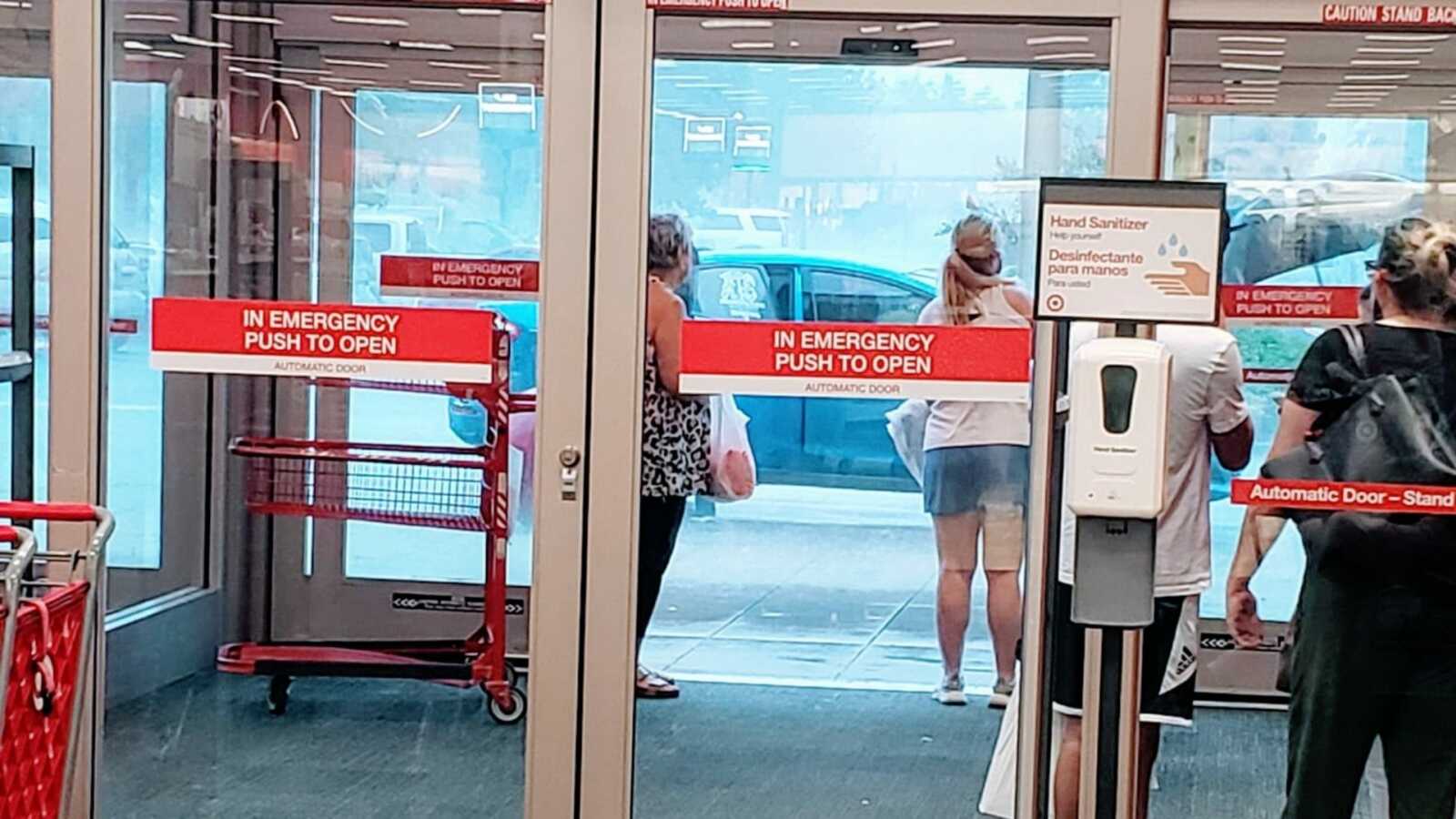 Mom takes a photo of shoppers waiting in Target for the heavy rain to stop before she went out in it