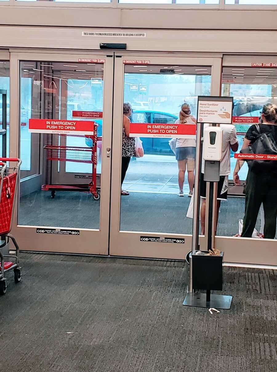 Mom snaps photo of shoppers waiting for the rain to let up before leaving Target