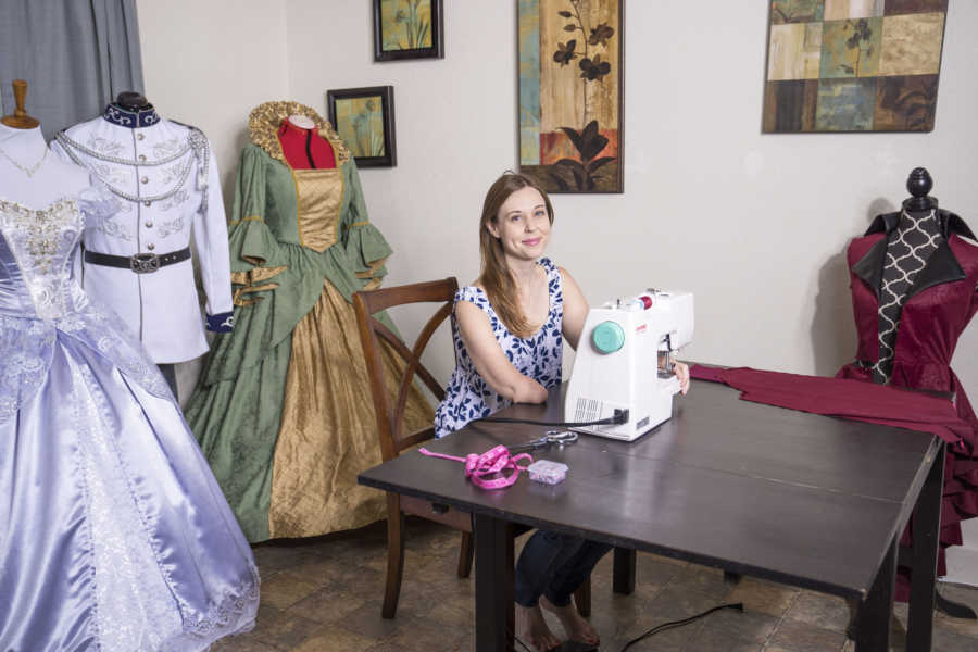 woman sewing with one arm