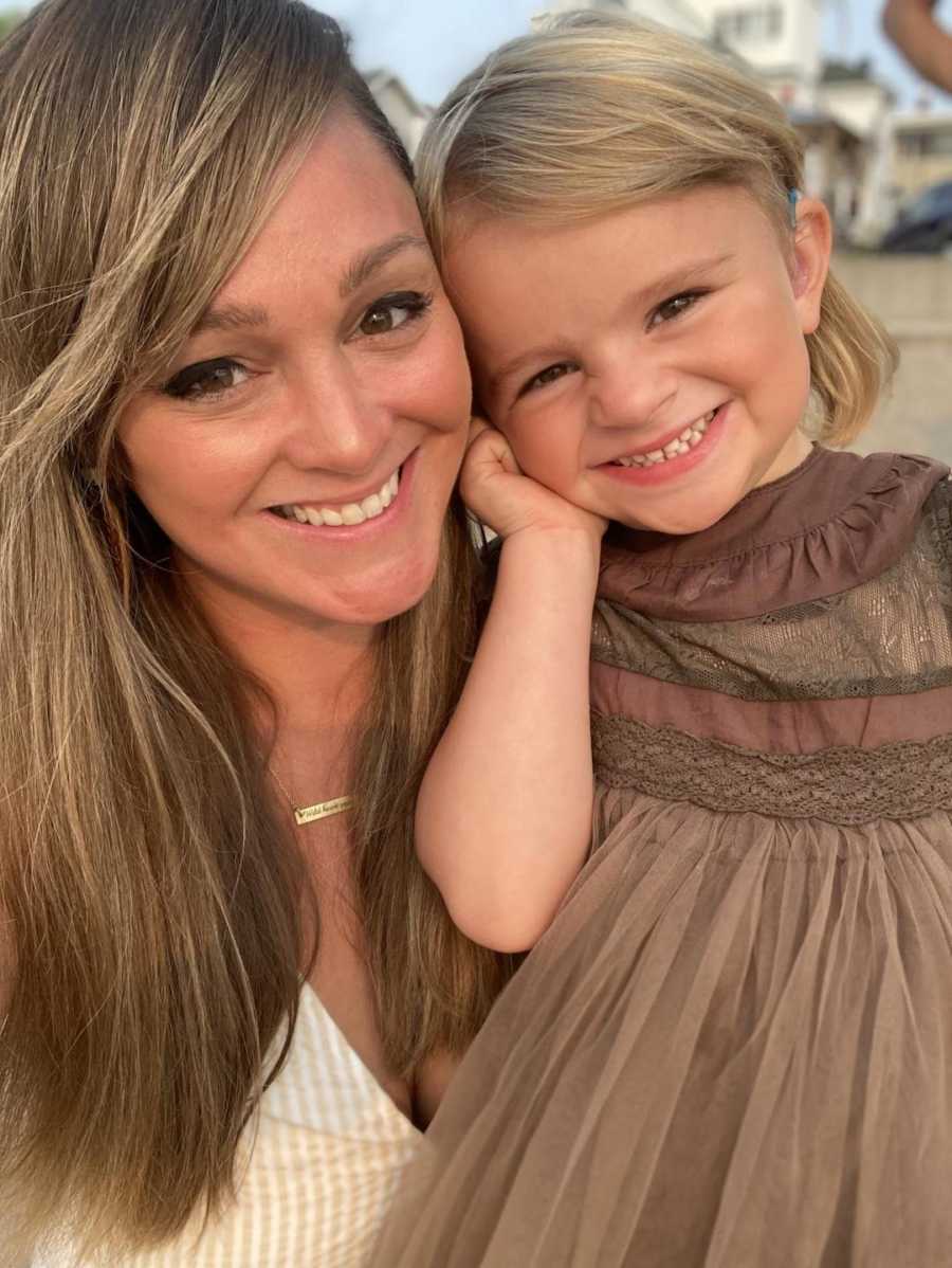 mom and her daughter with hearing aids