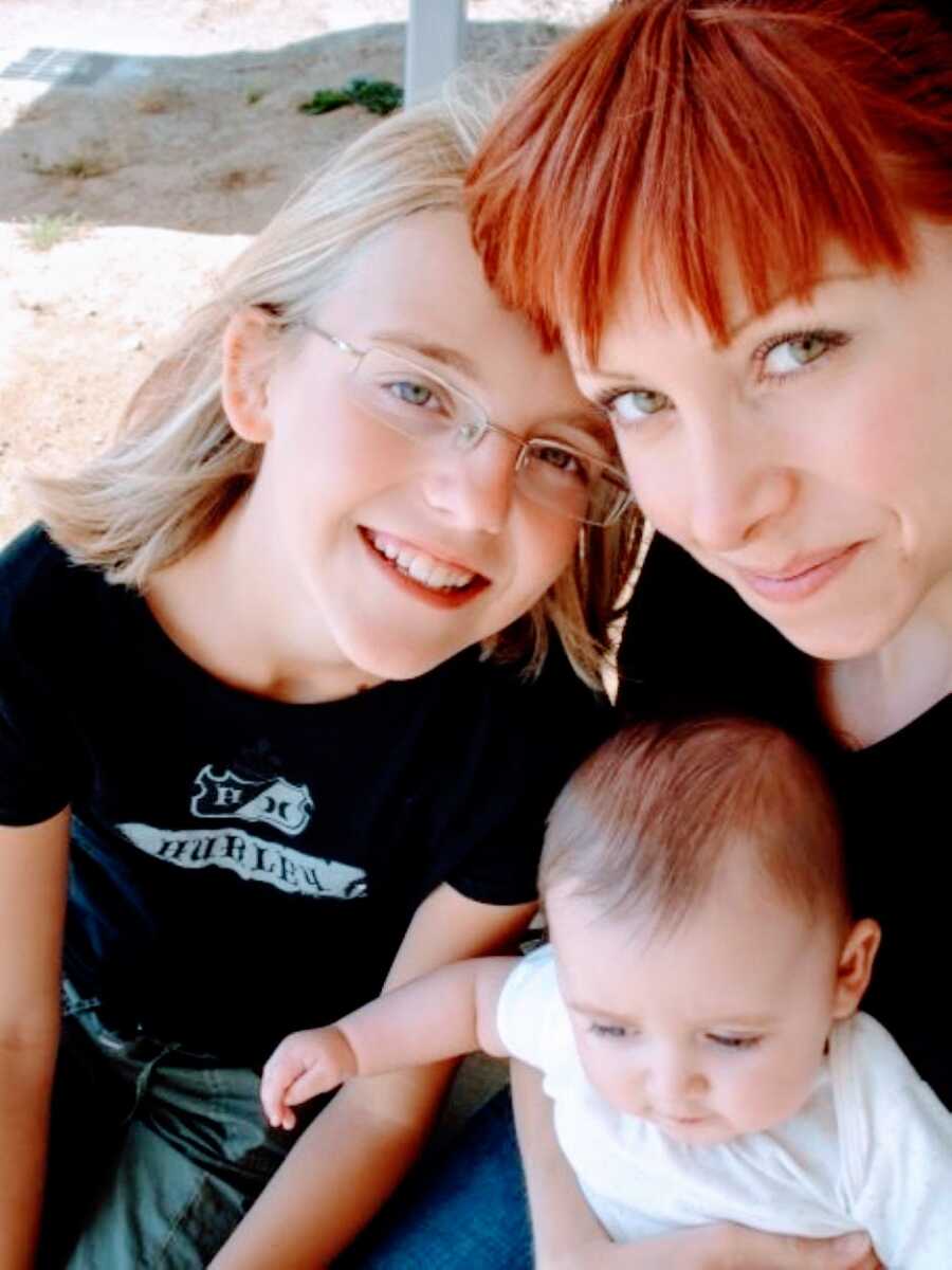 Young mom going through her second divorce takes a selfie with her two children