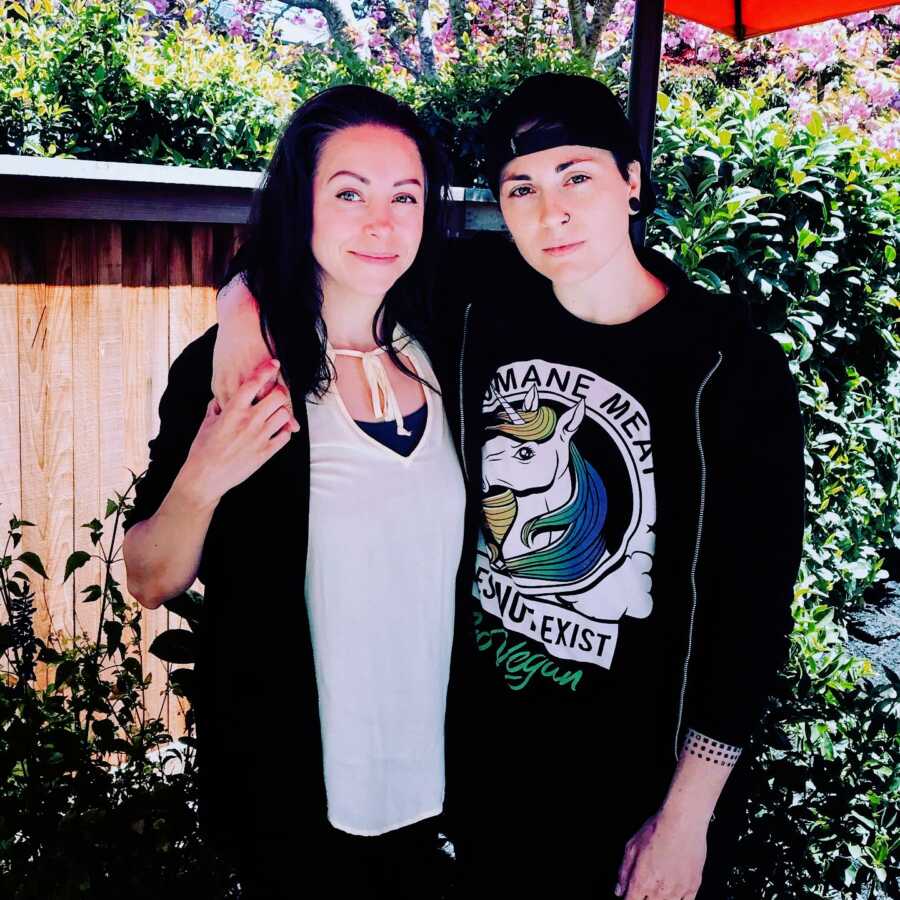 Woman recently diagnosed with autism and ADHD as an adult poses for a photo with their nonbinary partner