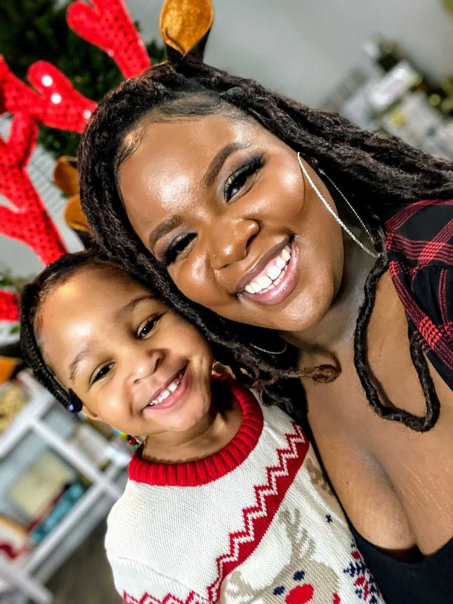 mom and daughter wearing reindeer ears