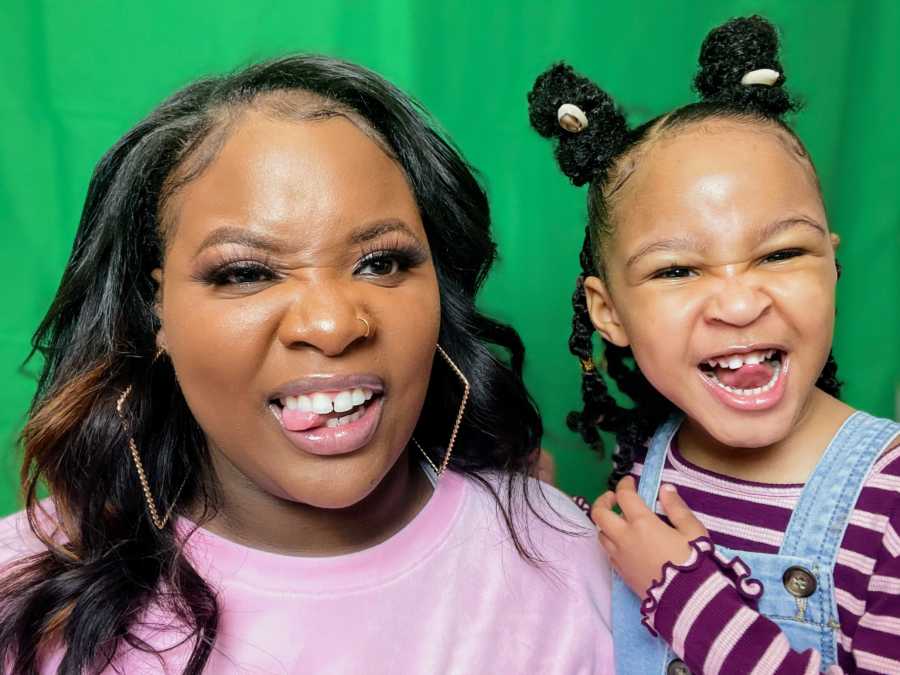 mom and her daughter, sticking their tongues out