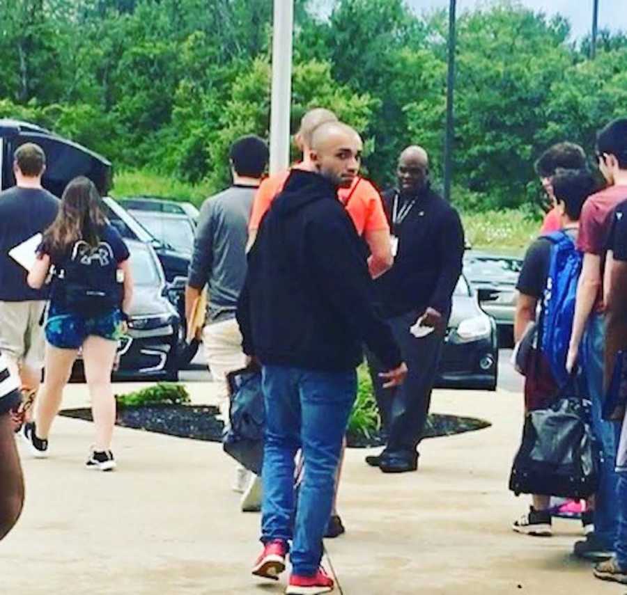 man walking onto the bus