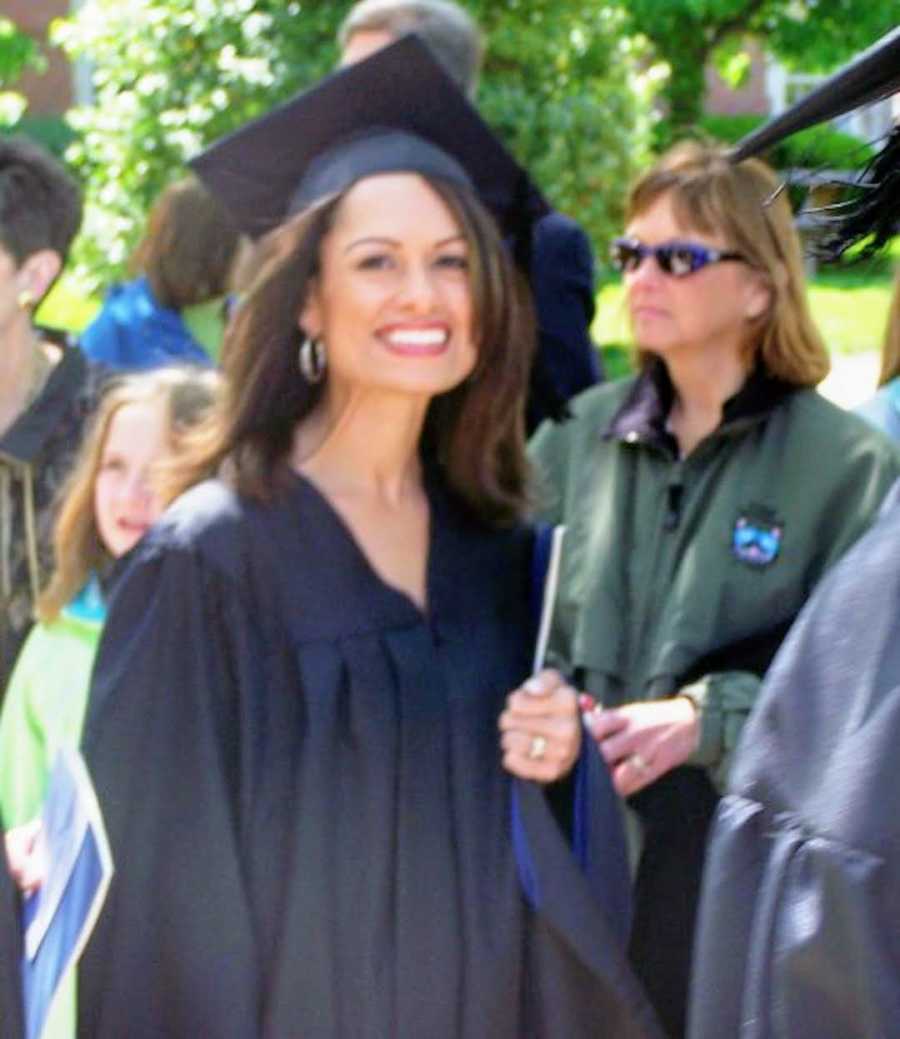 woman graduating college wearing cap and gown