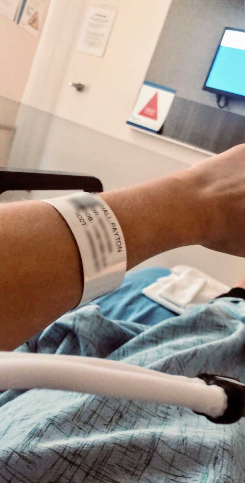 Woman snaps photo of her hospital band after being admitted for a severe panic attack from anxiety