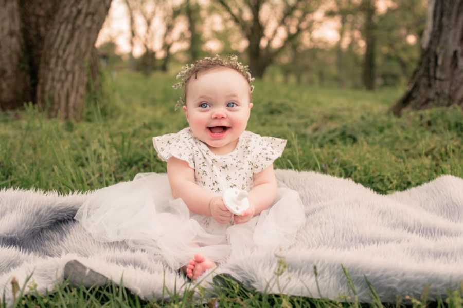 Little girl adopted out of foster care smiles big during a family photoshoot