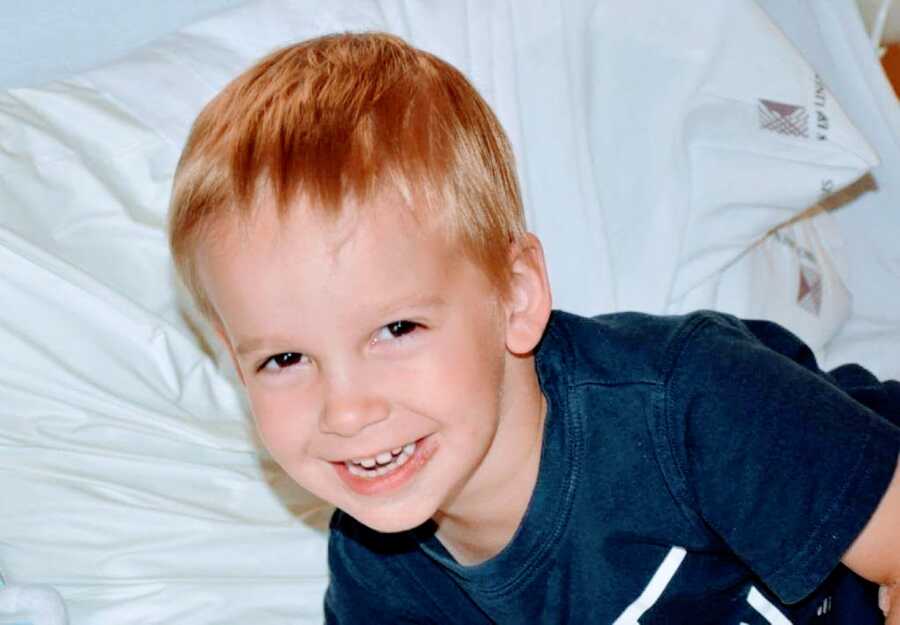 Little boy with undiagnosed seizures smiles while in a hospital bed