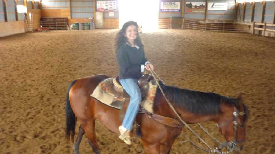 girl with cerebral palsy on horse