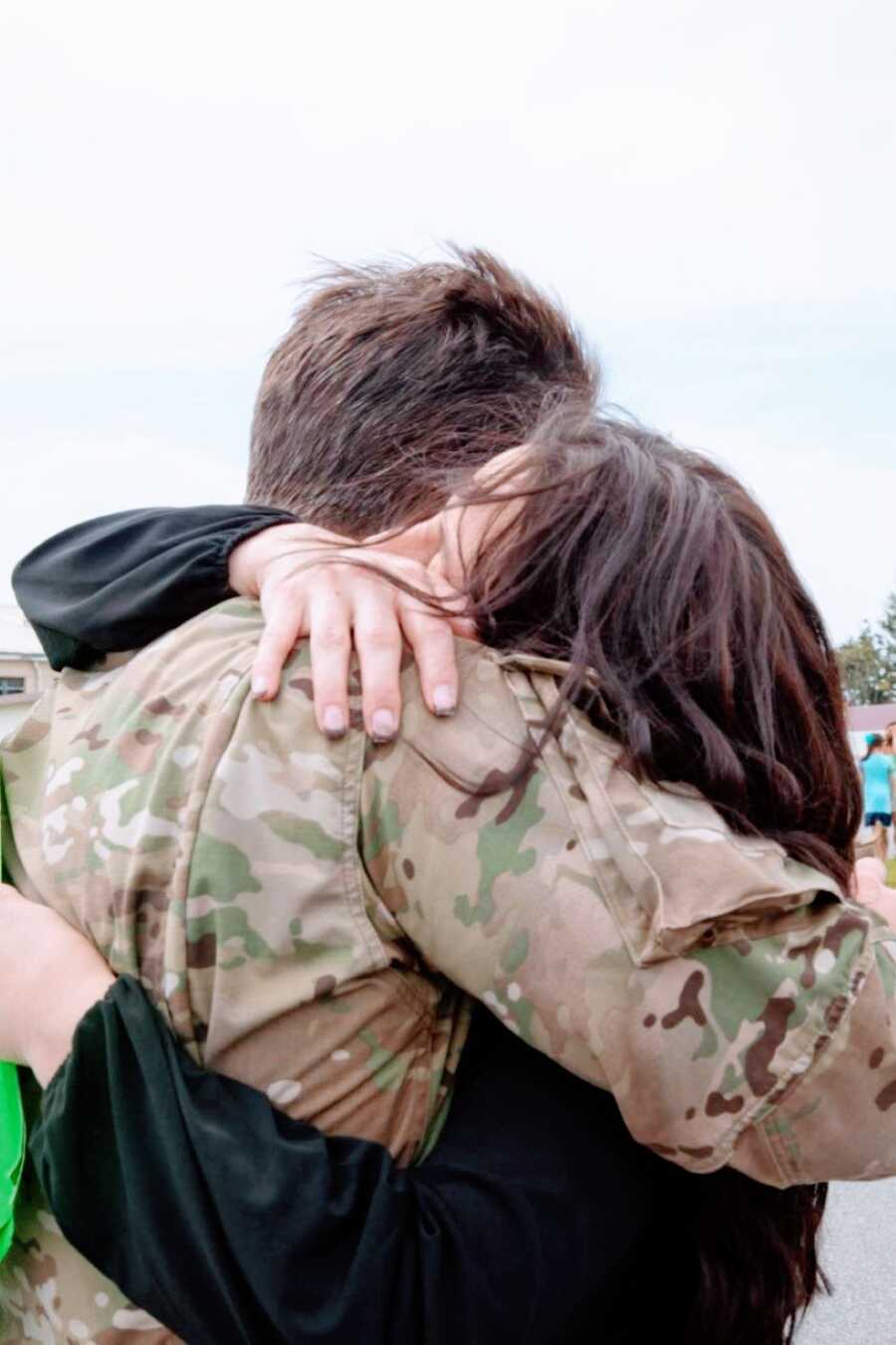 Military wife hugs her husband after he returns from serving in Afghanistan