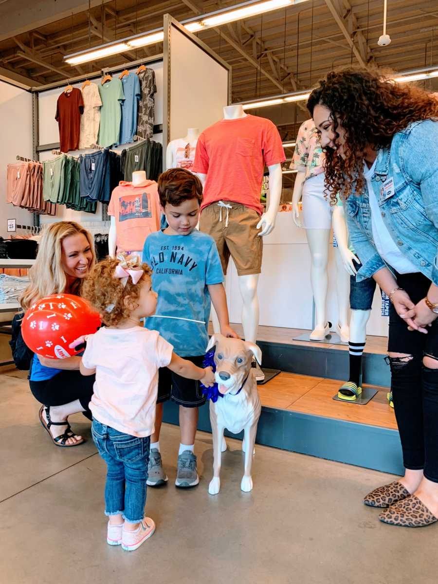 An Old Navy employee gifts an autistic child his very own Magic, the Old Navy mannequin dog