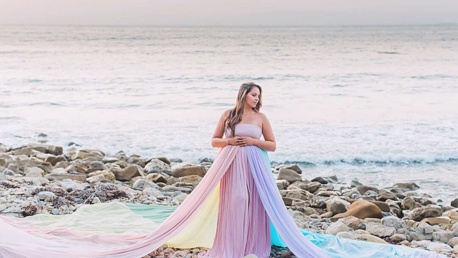 mom at ocean in beautiful rainbow dress