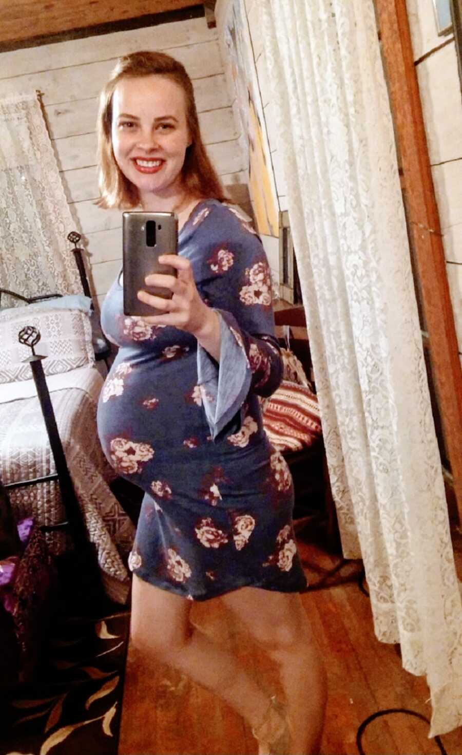 Pregnant woman wearing blue dress