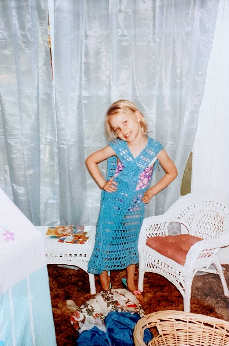 Young girl wearing blue dress