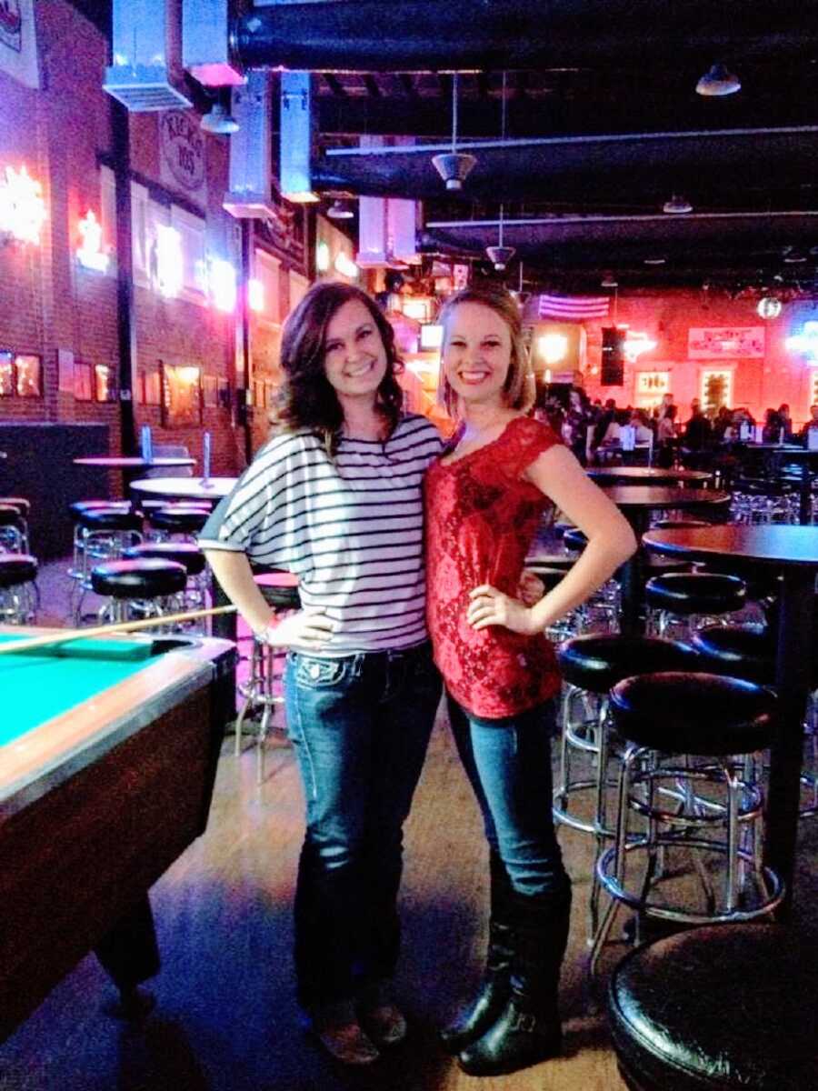 Young woman and a friend in a bar