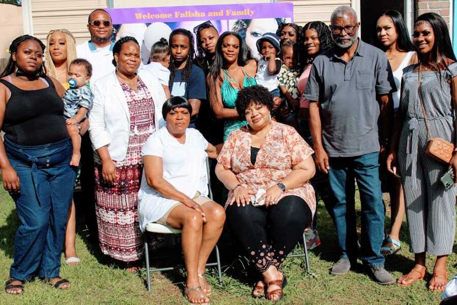 Adoptee sits with members of her biological family