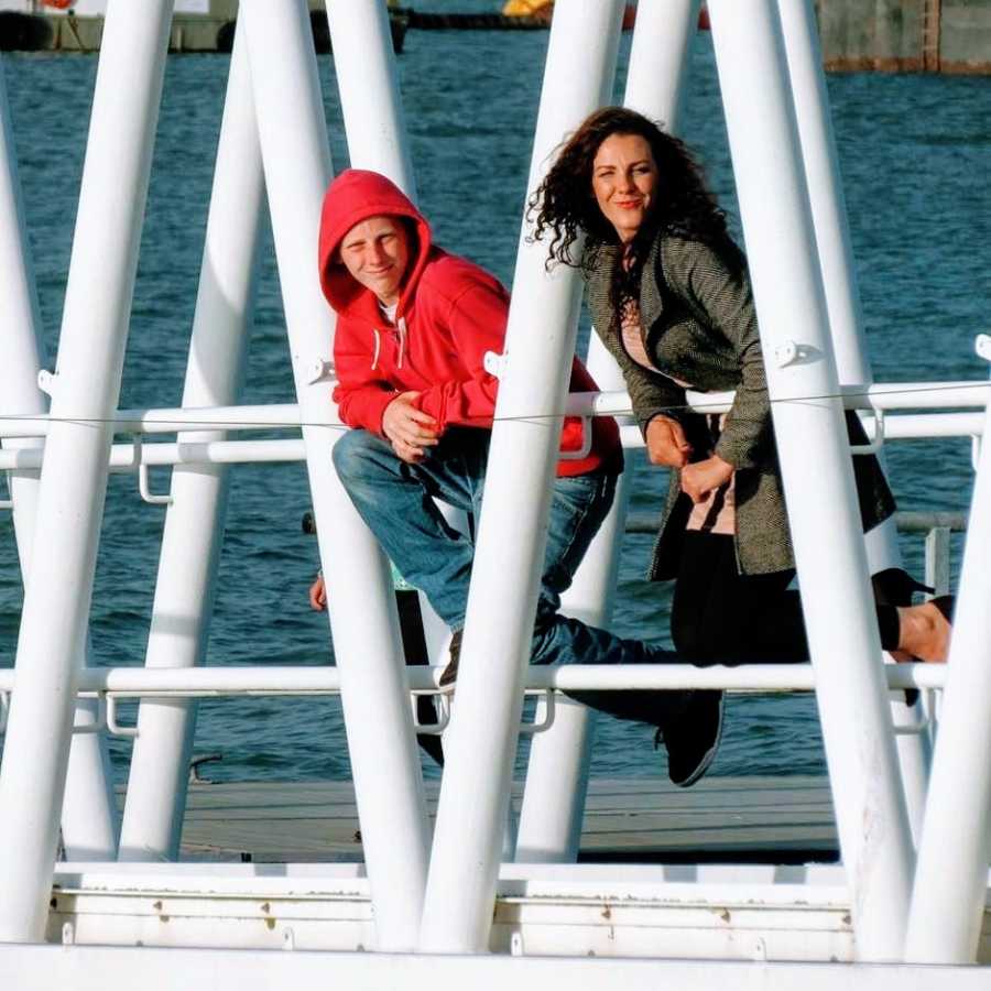 Woman and her son on a bridge