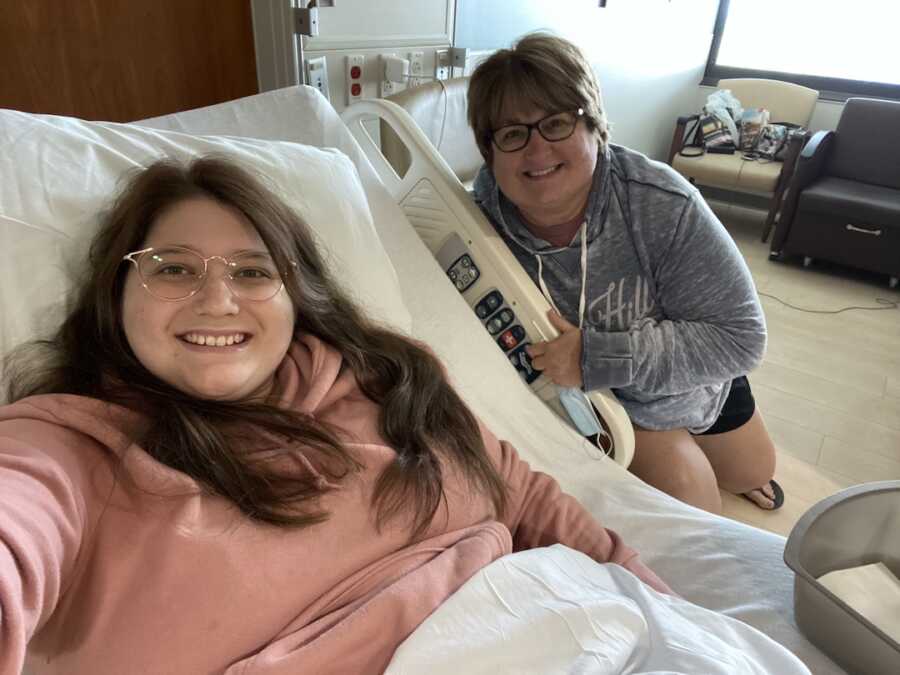 woman in recovery room with mom after surgery