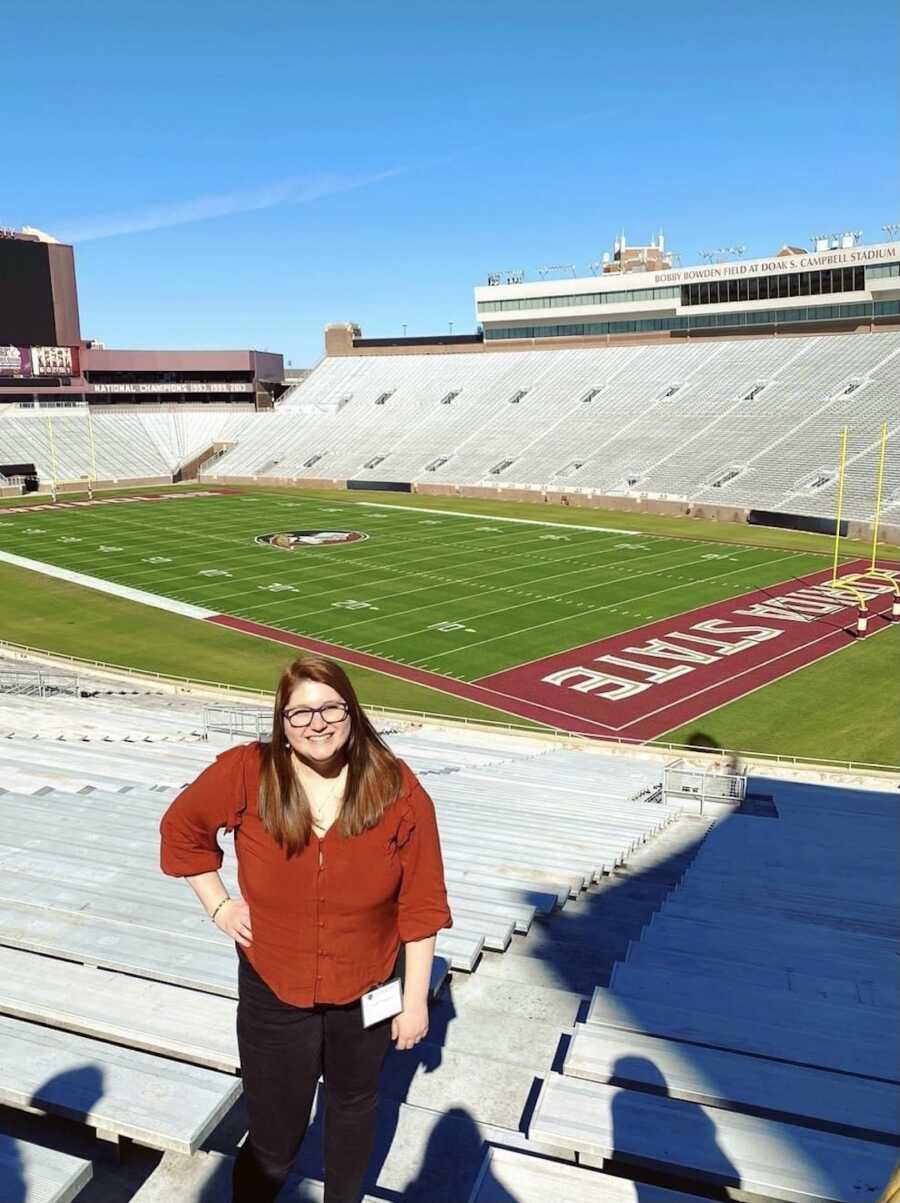 woman at a football stadium 