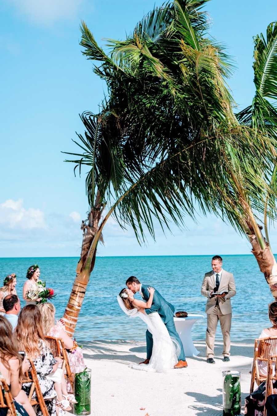 Groom dips chronically ill bride at wedding on beach