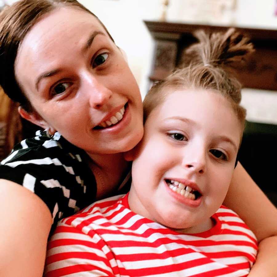 An Autistic boy and his mother sit together