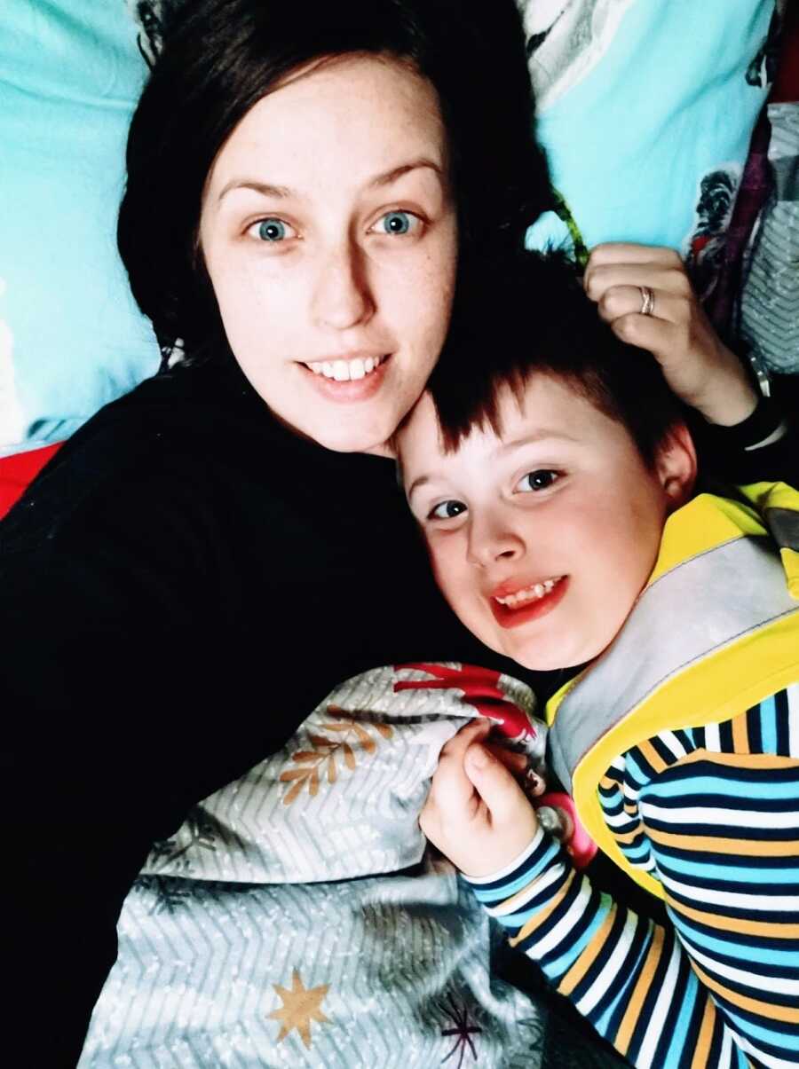 Mom holds son with autism to chest