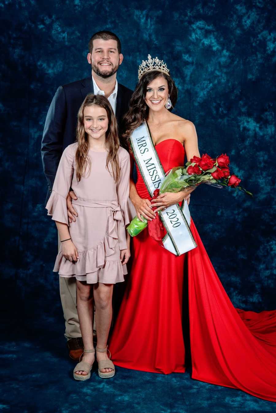 Pageant winner with daughter and husband