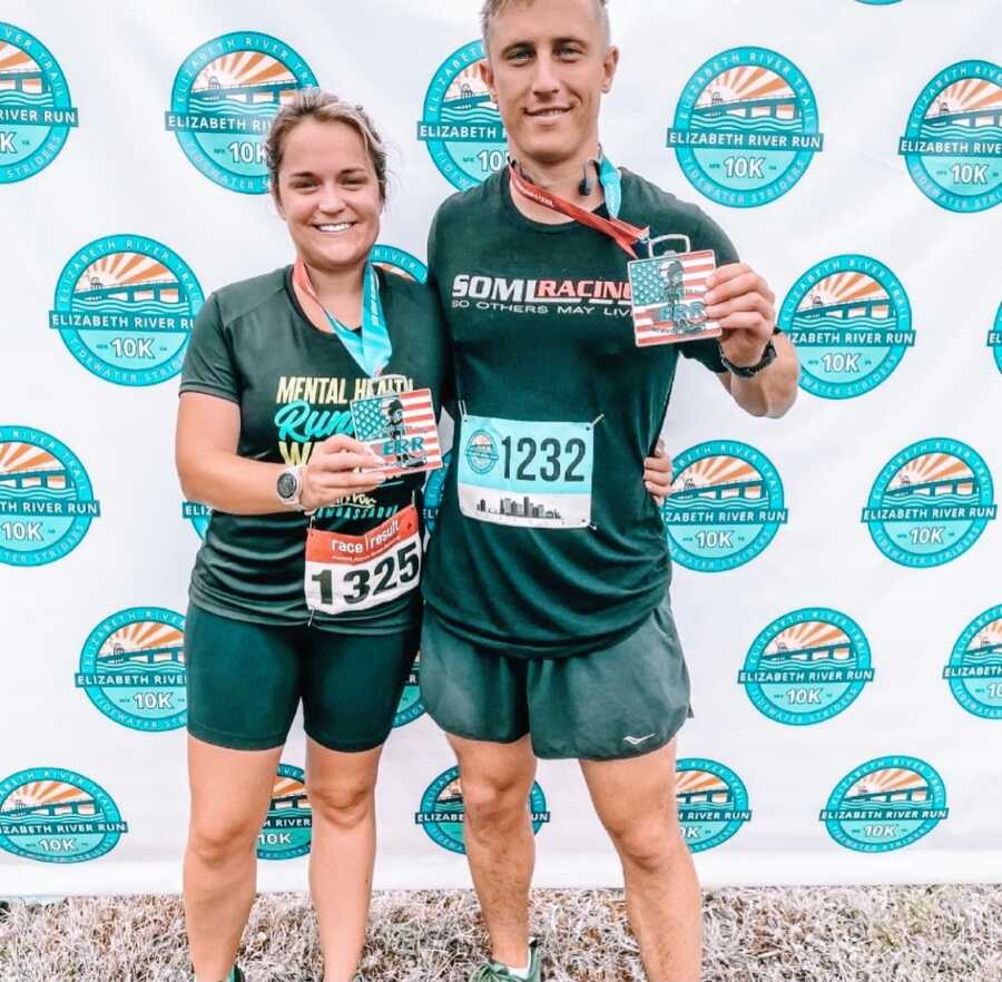 Woman advocating for mental health and sobriety takes a photo with her husband after completing a mental health 10K fundraiser event