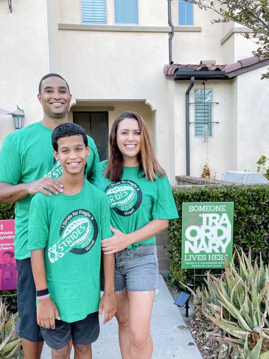 Special needs family take a photo with their son who has Fragile X Syndrome to promote a virtual fundraiser walk