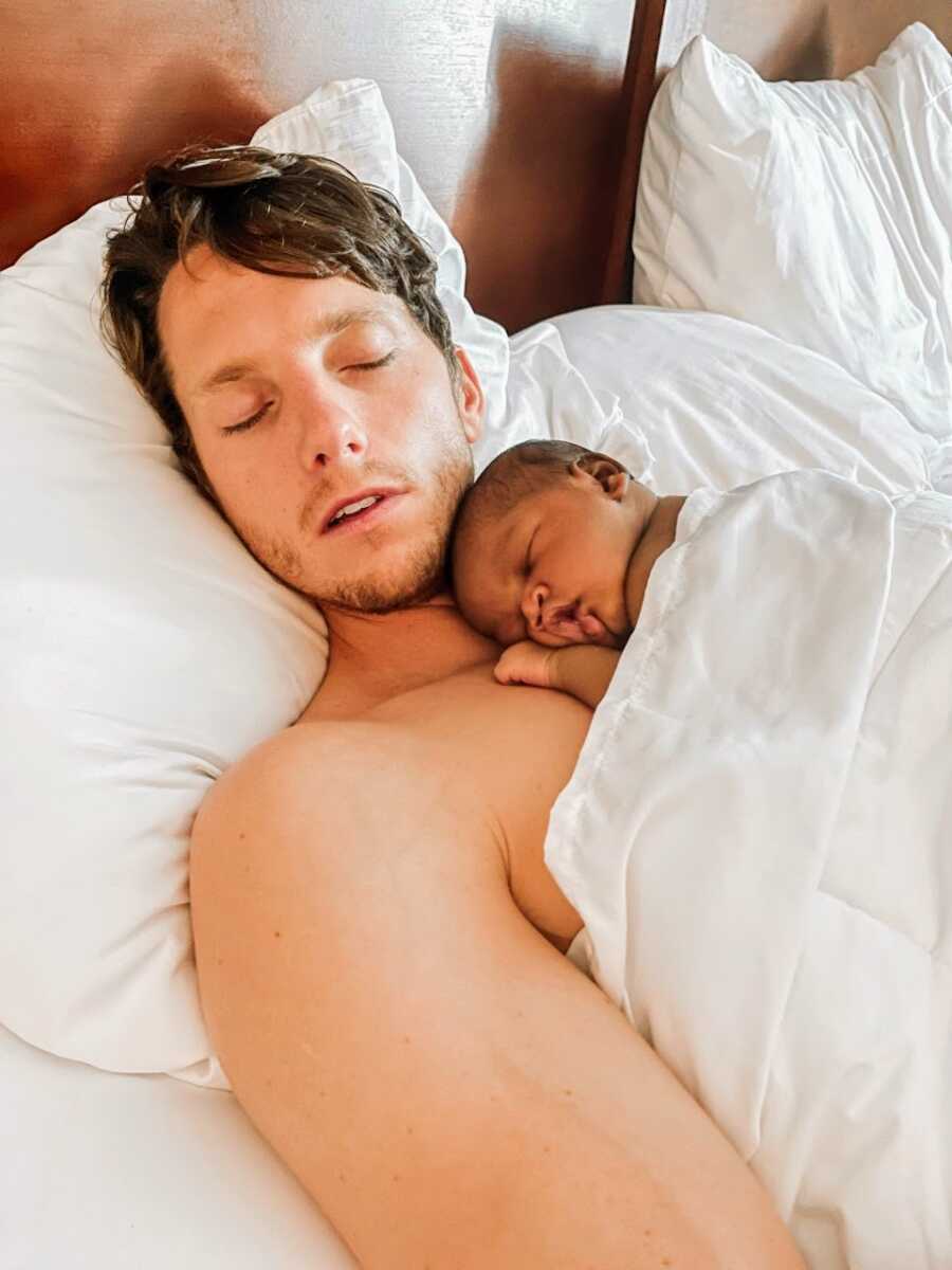 Adoptee takes a nap with his newborn adopted son