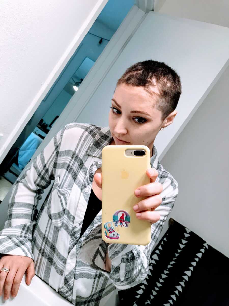 Woman fighting breast cancer lets her kids shave her head before she loses all her hair