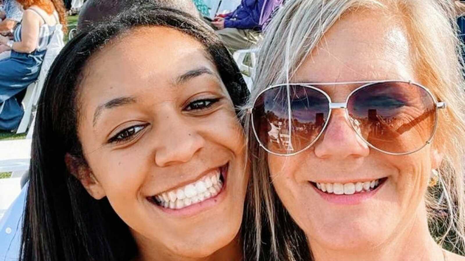 Mom and daughter smile big for a selfie while spending some quality time together