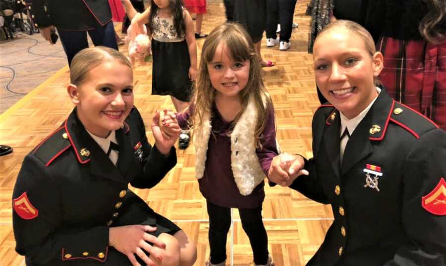 Marines with a little girl