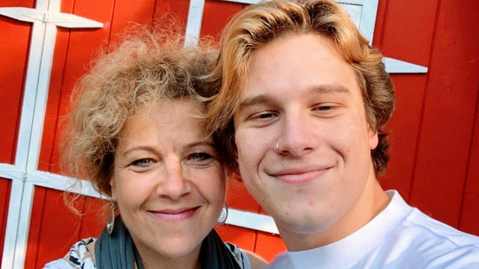 Mom and son take a selfie together before the son goes off to college