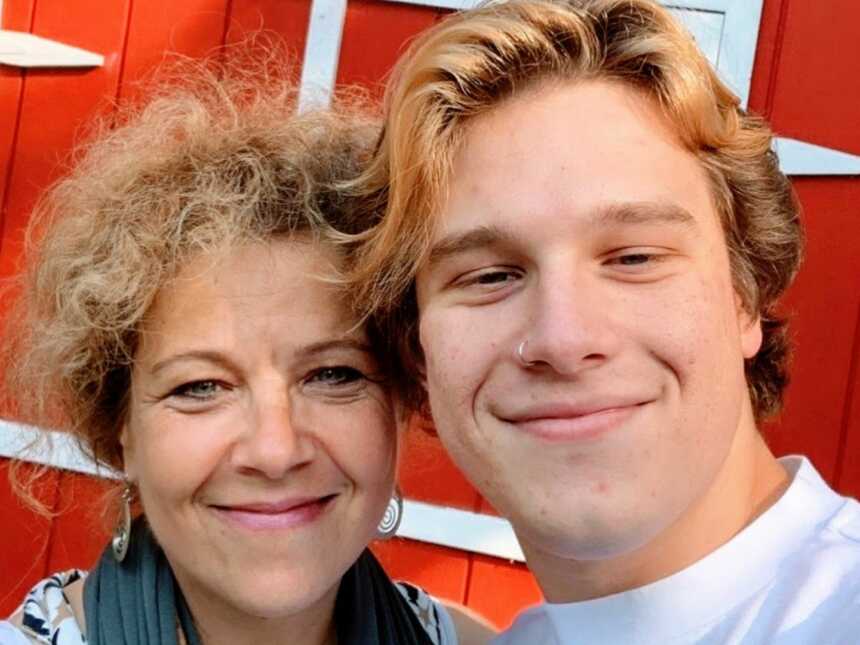 Mom and son take a selfie together before the son goes off to college