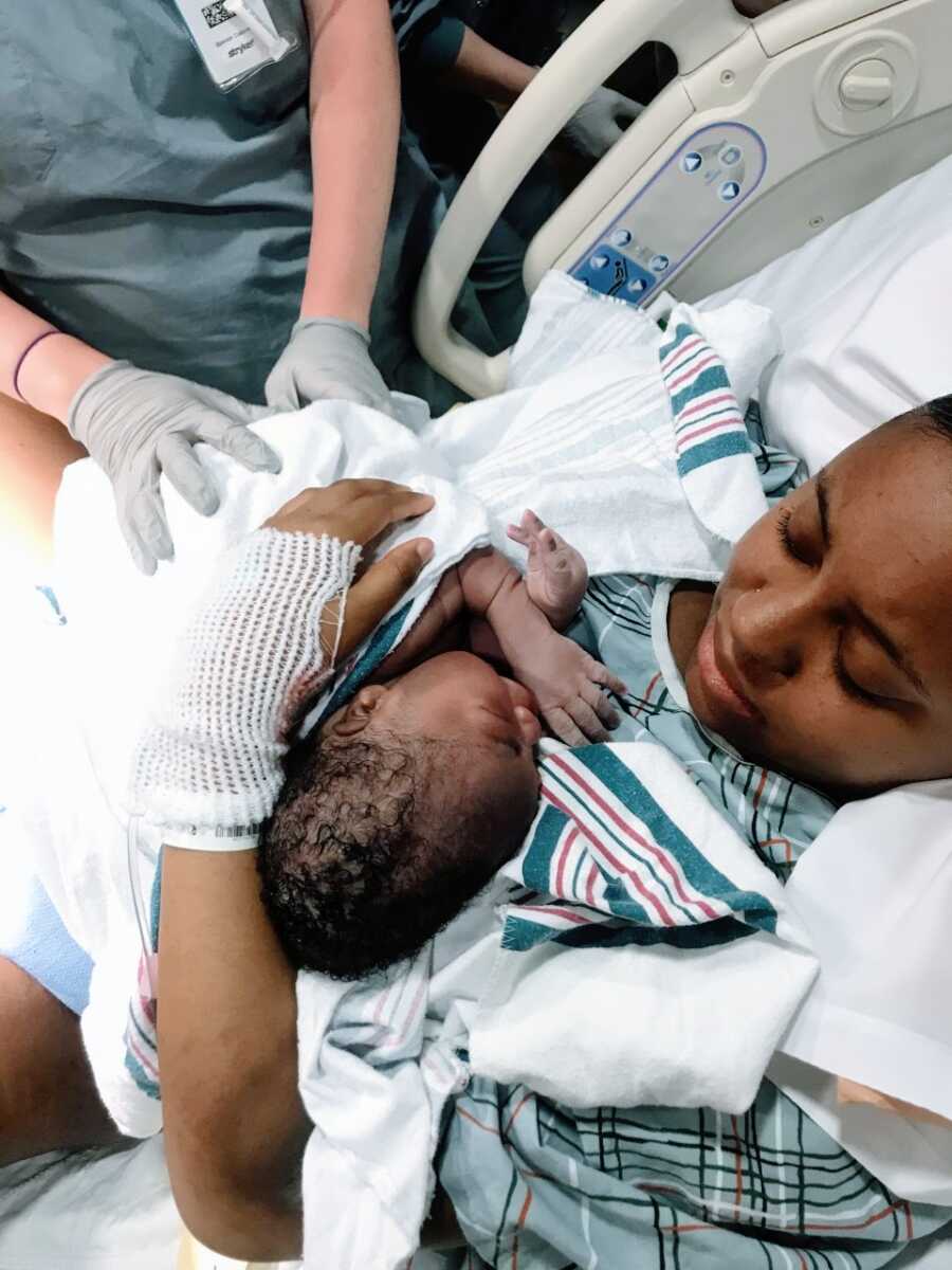 New teen mom holds her son in the hospital for the first time after giving birth to him