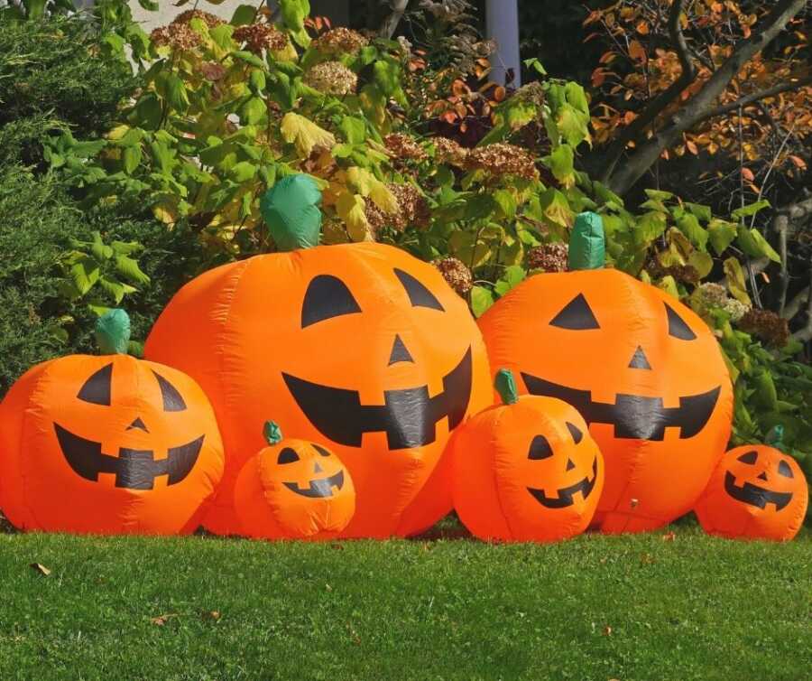 Large inflatable Jack-o-lanterns for yard Halloween decorations.