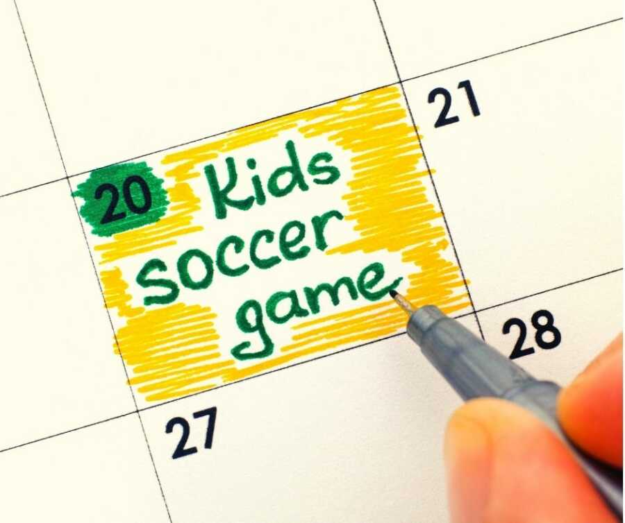 Parent marks "Kids soccer game" on their calendar. 