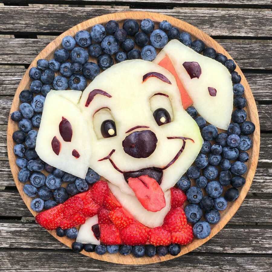 Edible food art fruit platter scene of a Dalmatian puppy. 