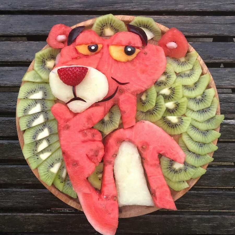 Edible food art fruit platter scene of the Pink Panther.