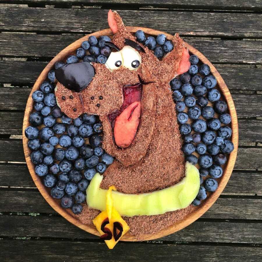 Edible food art fruit platter scene of Scooby Doo.