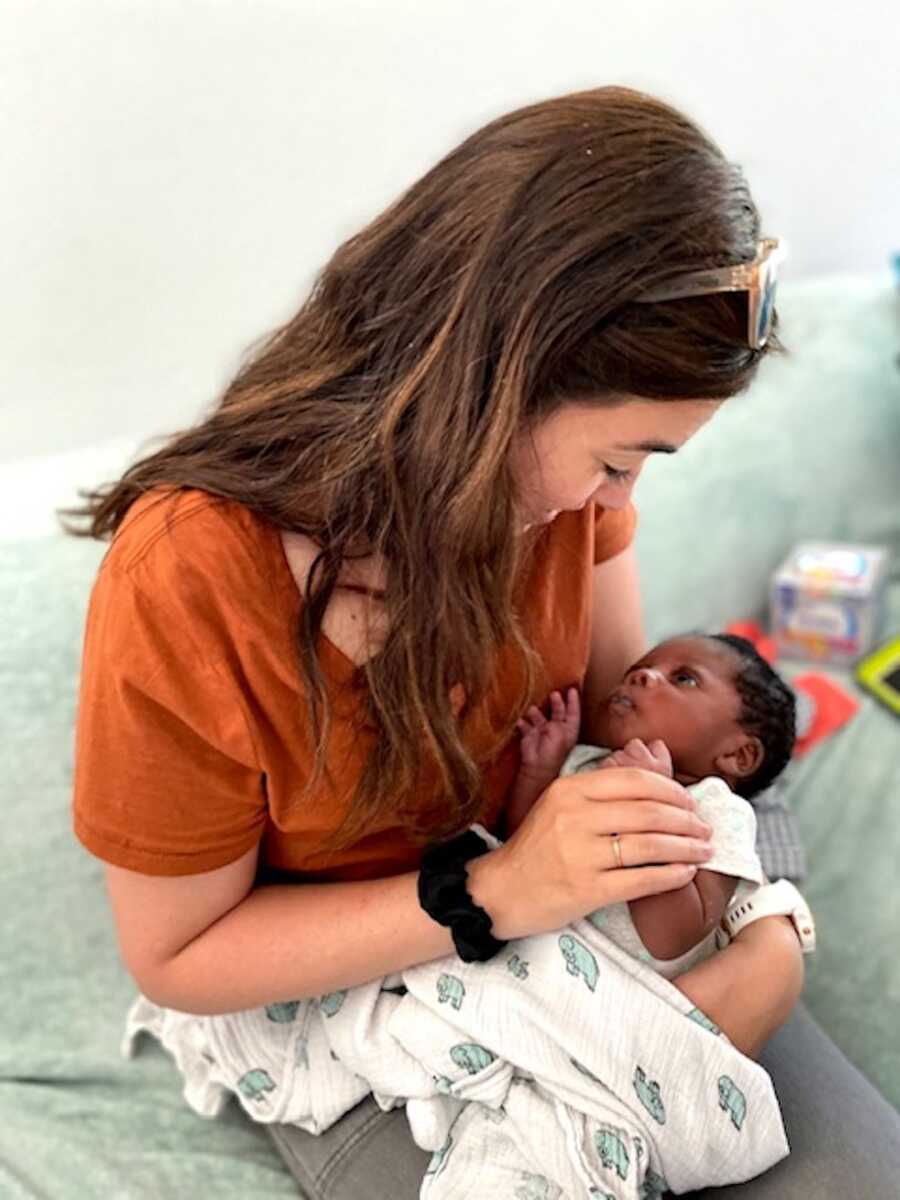 mother holding adoptive baby boy