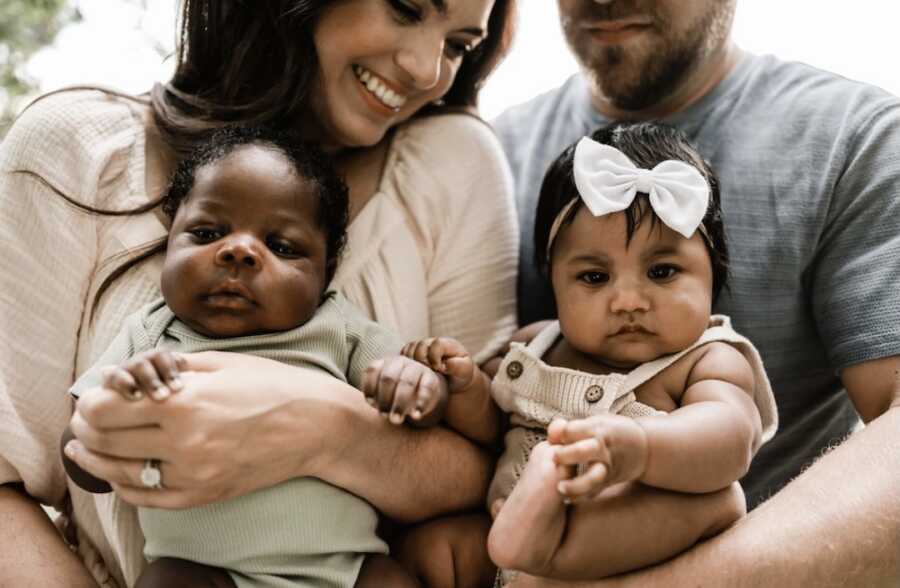 mother and husband with two adoptive babies