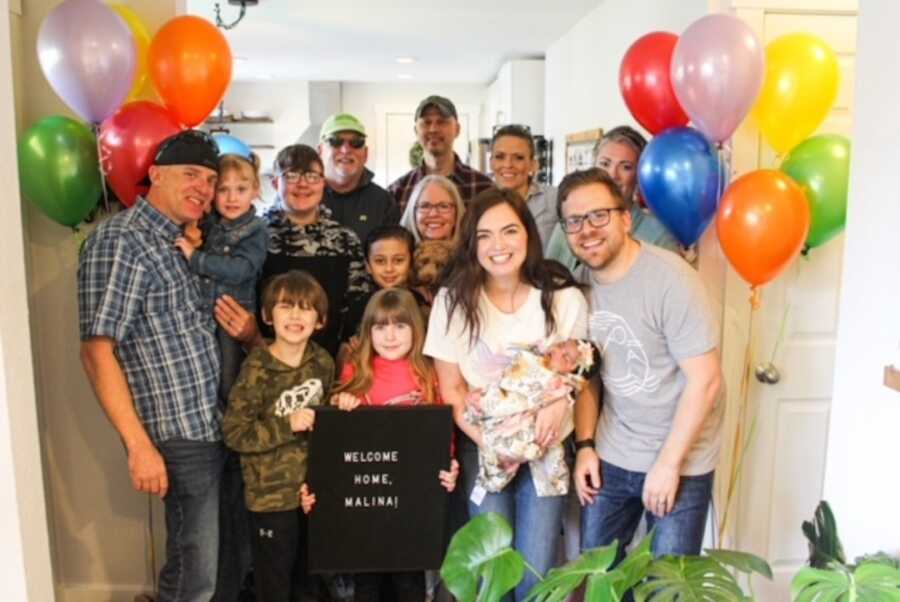 adoptive baby arrives into new home