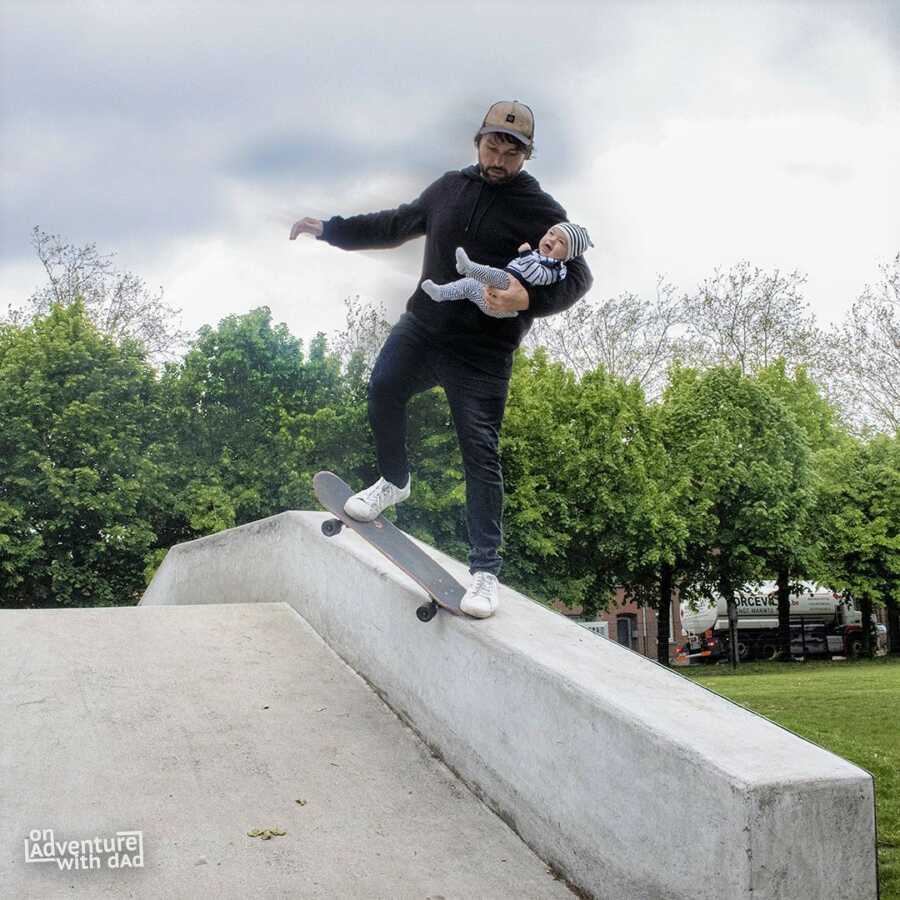 Dad photoshops performing skateboard trick while holding small baby.