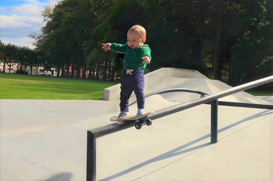 Dad photoshops baby performing difficult skateboarding trick. 