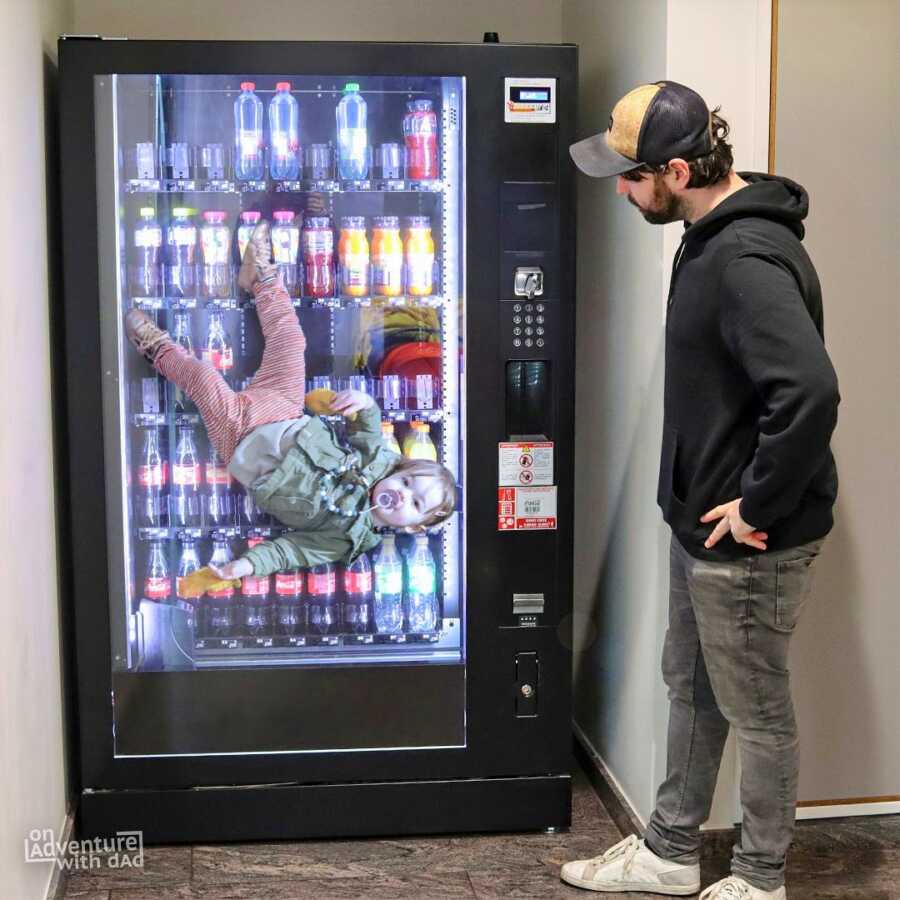 Dad photoshops toddler stuck in vending machine. 