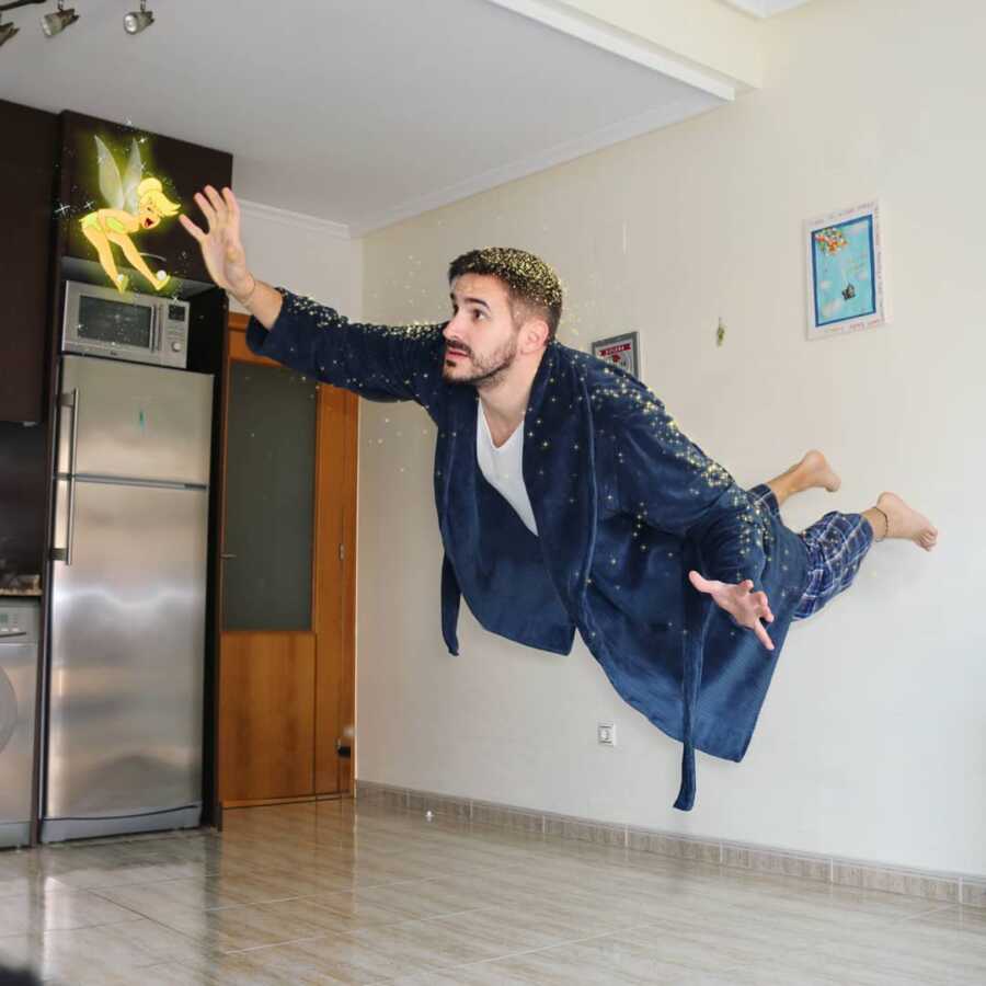 Man photoshops Disney character, Tinkerbell, into a scene of him covered in pixie dust, flying through his kitchen.