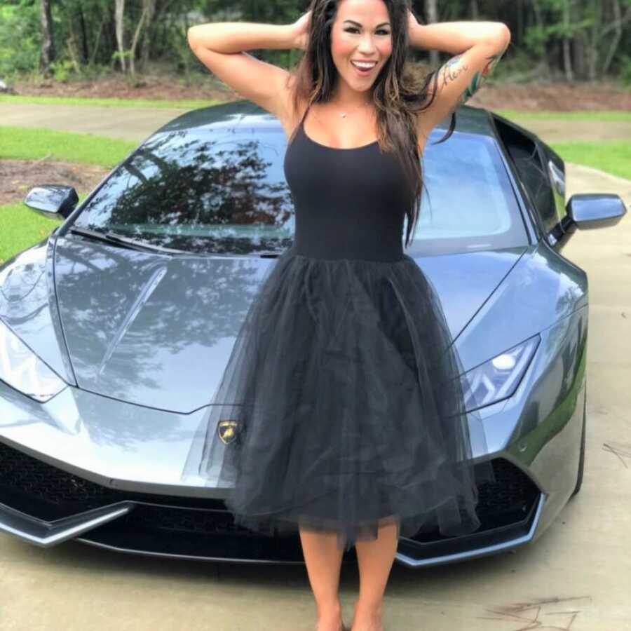 Woman in front of car